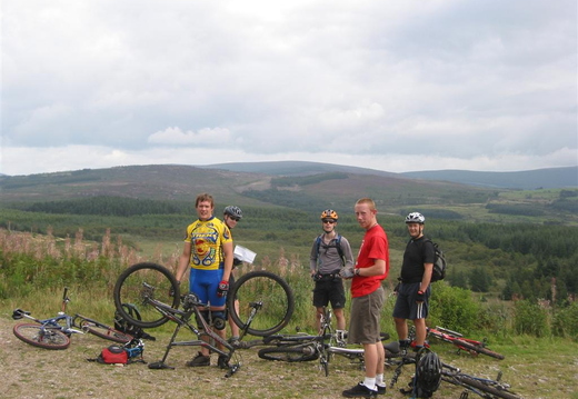 The Gang. Simon is sorting out another puncture :-) Bloke in red T-Shirt 'Kit' is newbie bloke [NW]