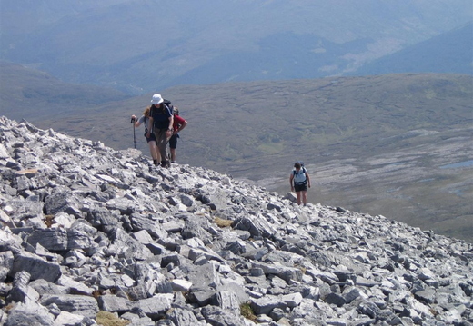 Rocky climb up to first top on Beinn Liath Mhor ridge