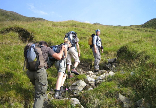 Start of the climb up to Na Gruahaichean. Sun came out and the ladies showed off their pins.