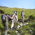 Start of the climb up to Na Gruahaichean. Sun came out and the ladies showed off their pins.