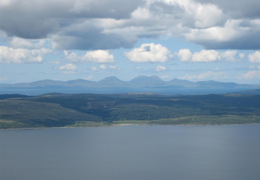 View over the water across the Mull to the paps of Jura