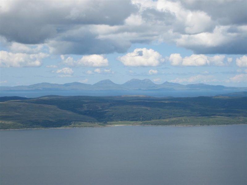 View over the water across the Mull to the paps of Jura