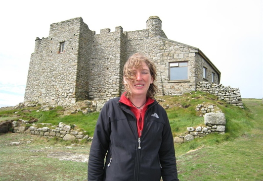 Lucy in front of castle Ruins