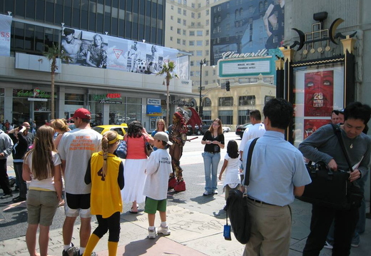 People dressed as characters from various films posing with people (for a fee)