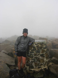 Me at the summit of Cradle Mountain (shit weather!)
