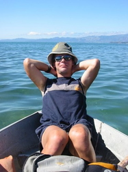 Me, trying to pose while in an old rowing boat that had a leak!