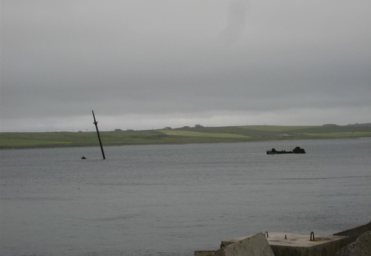 Masts and hulls from long sunken ships on Orkney