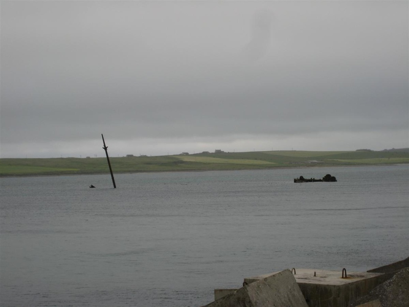 Masts and hulls from long sunken ships on Orkney