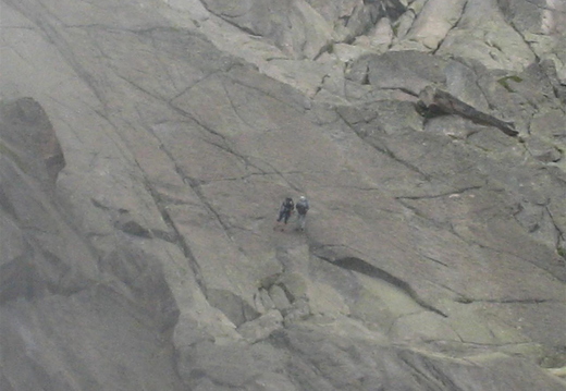 2 climbers abbing off to the left of the Les Pelerins glacier