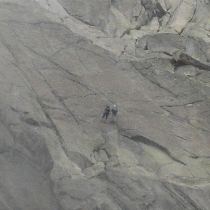 2 climbers abbing off to the left of the Les Pelerins glacier