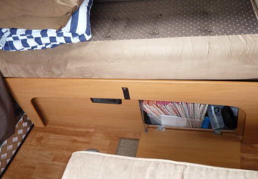 Cupboard under side sofa, more storage under sofa base