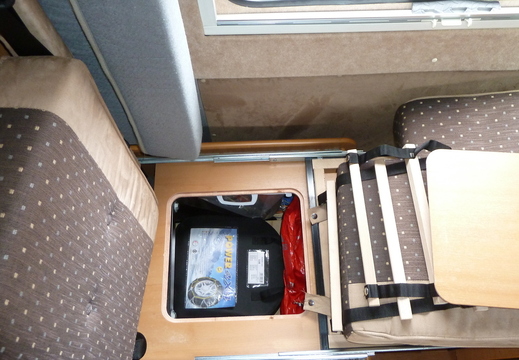 Storage under rear travel seat