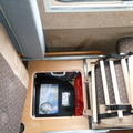 Storage under rear travel seat