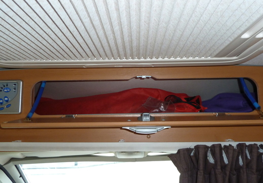 Locker above cab. Will take folding camping chairs etc