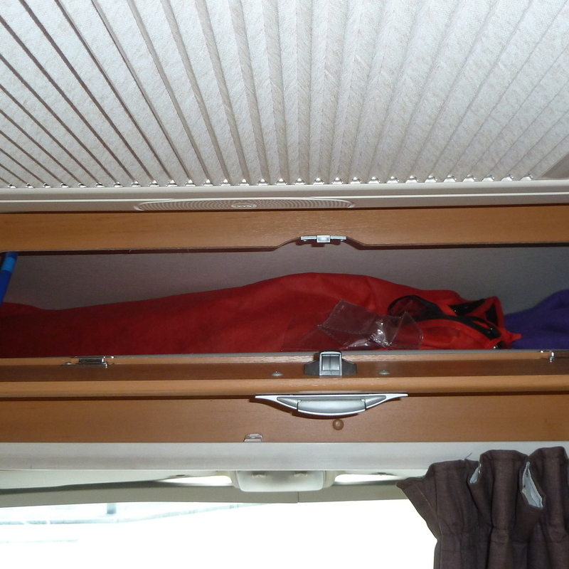 Locker above cab. Will take folding camping chairs etc
